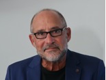 A person with a beard and glasses